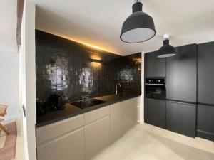 Appartements Au Vieux Bassin : photos des chambres