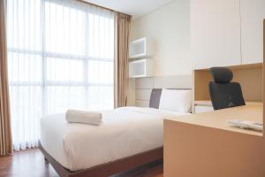 Nice and Comfort 2BR Apartment at The Kencana Residence By Travelio