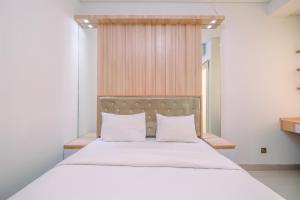 Cozy Living and Homey Studio Transpark Cibubur Apartment By Travelio