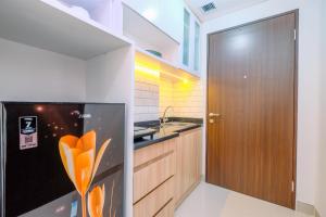 Cozy Living and Homey Studio Transpark Cibubur Apartment By Travelio