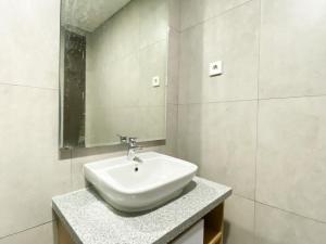 Simply Studio at Pollux Chadstone Apartment By Travelio