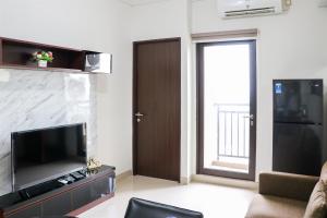 Comfort and Cozy Stay 2BR at 29th Floor Transpark Cibubur Apartment By Travelio