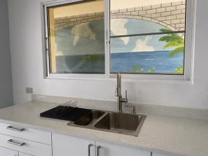 1BR Suite at Villa Costa Verde near Playa Cofresi, Puerto Plata, with a pool, balcony and a rooftop terrace