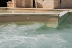 HelloApulia - Masseria Petra Antica - Charming Family Retreat with Pool & Gym in Itria Valle