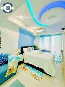 Ocean theme Navy Blue Deluxe Suite with PS4 and Balcony overlooking Manila Bay and Manila Zoo plus near Manila Yacht Club and Star City