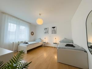 110qm - 4 Zimmer - privat Parkplatz - zentral - Balkon - MalliBase Apartments