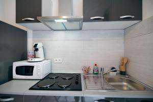 Appartements Verdant Oasis - proche du centre - Wifi gratuit - parking a proximite : photos des chambres