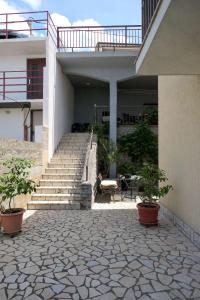 Apartments with a parking space Senj - 15376 