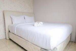 Homey 2BR Apartment at The Edge Bandung By Travelio