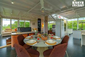 The Glasscape by StayVista - Hillside getaway with Pool and Indoor games