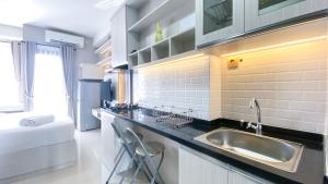 Simple and Cozy Living Studio Transpark Cibubur Apartment By Travelio