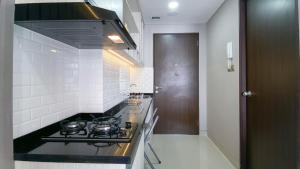 Simple and Cozy Living Studio Transpark Cibubur Apartment By Travelio