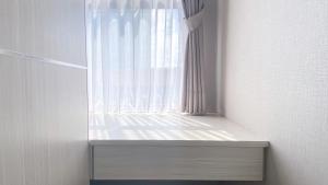 Simple and Cozy Living Studio Transpark Cibubur Apartment By Travelio