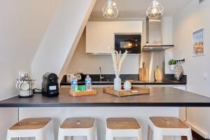 Appartements OIQIA • Intemporel : photos des chambres