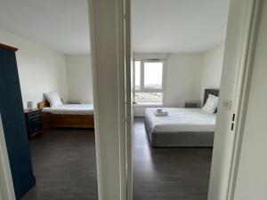 Appartements A 500m Paris, 130m2 avec 4ch, balcon et parking : photos des chambres