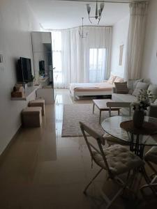 Modern Studio Oasis - Skyline Views, Private Balcony & Workspace