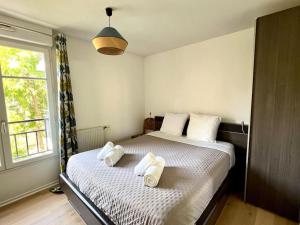 Appartements Charmant T2 avec balcon - Golf National a 5 min : photos des chambres