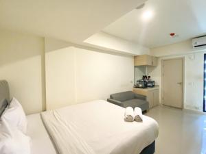 Simply Look and Enjoy Living Studio at Meikarta Apartment By Travelio