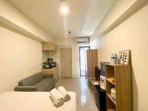 Simply Look and Enjoy Living Studio at Meikarta Apartment By Travelio