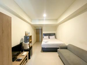 Simply Look and Enjoy Living Studio at Meikarta Apartment By Travelio
