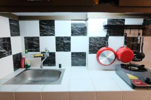 Homey and Cozy Studio Room at Suites @Metro Apartment By Travelio