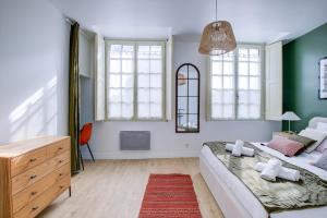 Appartements OIQIA • Harmonie : photos des chambres