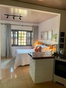 Suíte frente mar com cozinha e quintal pés na areia