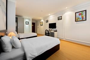 PHÒNG JUNIOR GIƯỜNG ĐÔI/2 GIƯỜNG ĐƠN NHÌN RA CẢNH THÀNH PHỐ (JUNIOR DOUBLE OR TWIN WITH CITY VIEW)