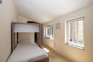 Villas Charmante maison dans venelle fleurie : photos des chambres