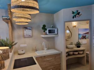Appartements Les Spas de la Mer, Appart&Spa Aloha, 100m de la plage, Plein coeur du Grau : photos des chambres