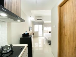 Modern Look and Tidy Studio Gateway Park LRT City Jatibening Apartment By Travelio