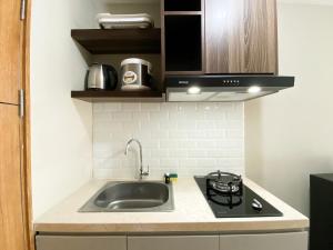 Modern Look and Tidy Studio Gateway Park LRT City Jatibening Apartment By Travelio
