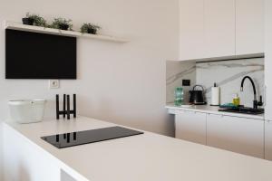 Sage Green Stylish Apartment by BookingHost