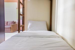 Homey 2BR at Suites @Metro Apartment By Travelio