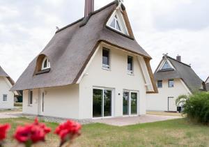Villa Haffblick - Ferienhaus mit Kamin, Sauna und Meerblick