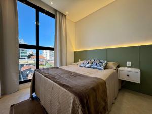 Excelente apartamento em Bombas com piscina