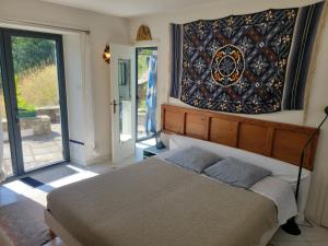 Sejours chez l'habitant Chambre et terrasse dans une ancienne bergerie : photos des chambres