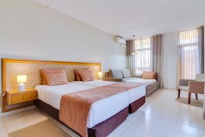 Twin Room (2 Adults + 1 Child) room in Auramar Beach Resort