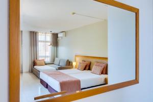 Twin Room (3 Adults + 1 Child) room in Auramar Beach Resort