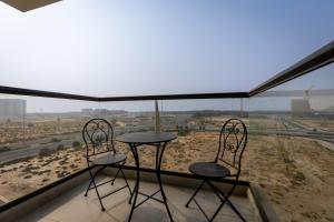 Waves - Stylish 1BR Close to IMG World & Global Village