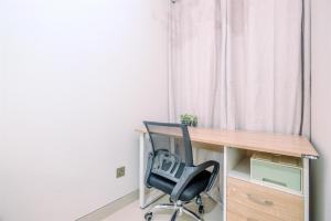 Minimalist and Cozy Studio (No Kitchen) Transpark Cibubur Apartment By Travelio