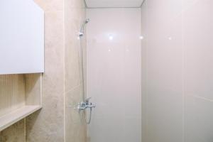 Fully Furnished with Cozy Design Studio Transpark Cibubur Apartment By Travelio