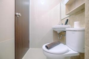 Fully Furnished with Cozy Design Studio Transpark Cibubur Apartment By Travelio