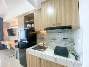 Good Deal and Elegant Studio Vasanta Innopark Apartment By Travelio