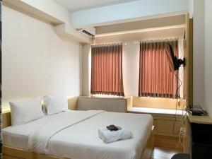 Relaxing Studio at Patraland Urbano Apartment By Travelio