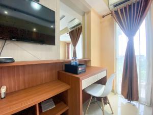Cozy Studio Room at Oasis Cikarang Apartment By Travelio
