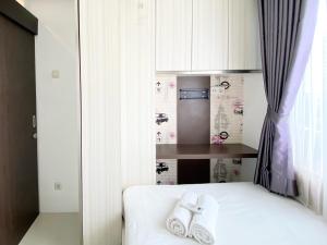 Modest 2BR Apartment at Jarrdin Cihampelas By Travelio