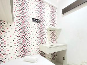 Modest 2BR Apartment at Jarrdin Cihampelas By Travelio