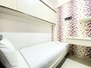 Modest 2BR Apartment at Jarrdin Cihampelas By Travelio