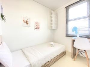 Cheerful and Homey 2BR Apartment at Parahyangan Residence By Travelio